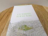 a book on a table with a drawing of a building on it