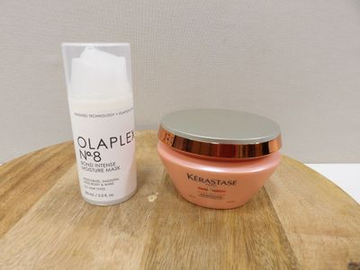 an image of a bottle of cream and a container of cream on a wooden table