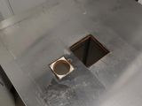a metal table with a hole in the middle of it