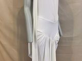 the mannequin is wearing a white dress and a scarf