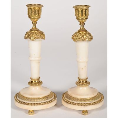 pair of antique brass candlesticks with white marble bases