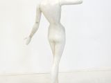 white marble statue of a woman holding her hand out