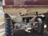 an image of a tractor with a trailer attached to it
