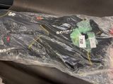 a plastic bag with some items in it on a couch