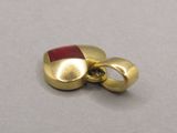 an image of a close up of a gold plated object on a table