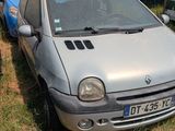 a silver car that is parked in the grass