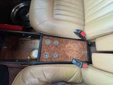 beige leather seats in a car with a wooden center console