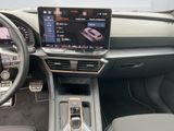 the interior of a car with a touch screen and steering controls