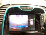 a picture of a car dashboard with a tv in it