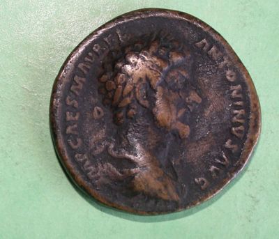 an old coin with a picture of a woman on it