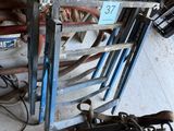 a pile of assorted items on the floor in a garage
