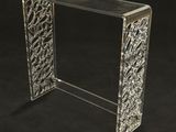 a clear acrylic console table with a glass top