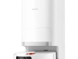 a white water dispenser sitting on top of a white counter