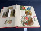 an open book with a picture of a violin and flowers on it