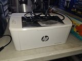 a printer that is sitting on a counter next to a coffee pot
