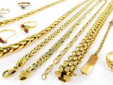 several different types of gold jewelry including rings, bracelets, and rings