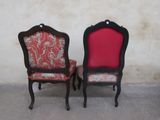 two chairs that are sitting next to each other