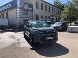 a car that is parked in front of a building