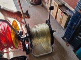a man that is pulling a reel in a room