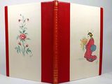 a red and white book with a picture of a bird on it