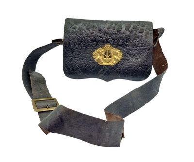 leather belt bag with a gold buckle on a white background
