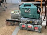 a green generator sitting on top of a stack of boxes