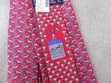 a red tie with a blue and white design on it