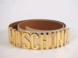 a close up of a gold belt with the word moschino on it