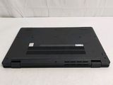 a black laptop sitting on a white surface