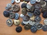 a lot of buttons that are on a table
