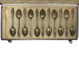six silver spoons in a box with a lid