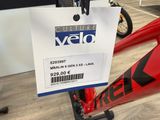 a red bike with a price tag attached to it