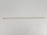 an image of a pair of knitting needles sitting on top of a table
