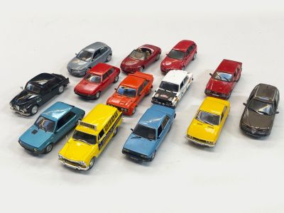 a lot of toy cars that are lined up together
