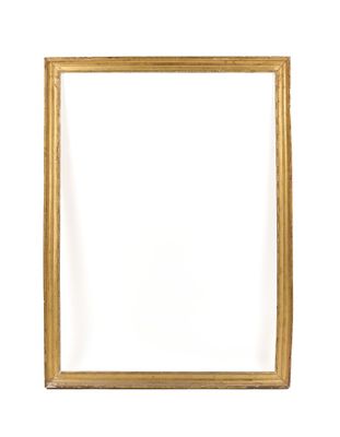 an empty gold frame on a white wall with a white background