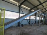a conveyor belt in the middle of a building