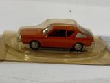 a toy car that is sitting on a clear plate