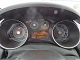 a car dashboard with a digital clock on it