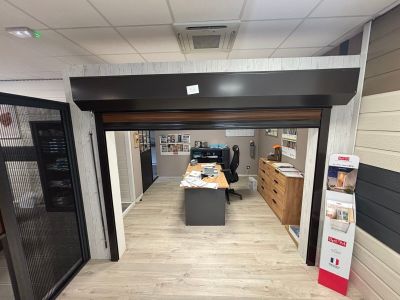 a room with a desk and a chair in it
