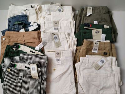 Lot de 15 jeans de diverses tailles CELIO et DOCKERS - NEUFS… - Photo 1