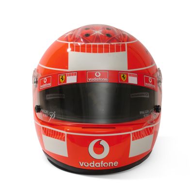 the helmet of michael schumacher, ferrari, is shown on a white background