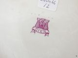 a picture of a plate with a crown on it