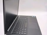 a black laptop with a black keyboard on a white surface