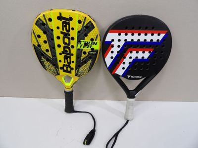 two paddles that are sitting on a table
