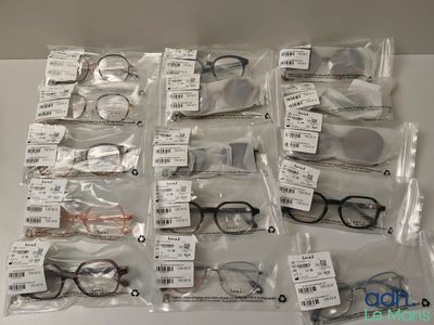 many pairs of glasses that are on the table