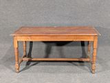 a small table with a wooden top on a gray surface