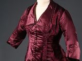 a woman ' s dress with a jacket on a mannequin mannequin mannequin mannequin mannequin mannequin mannequin mann