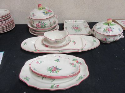 a black table with a bunch of plates and bowls on it