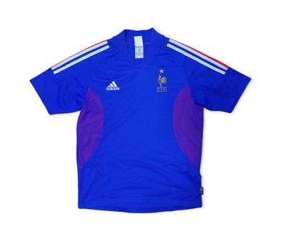 a blue shirt with a red and white stripe on the chest
