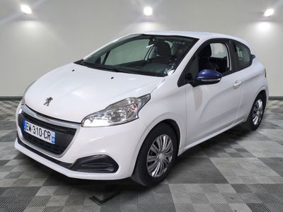 the small white car is parked in the garage on a checkered floor